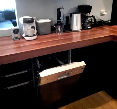 a wooden counter top with a box under it at Exarchia Square central Athens 110m2 apartment in Athens