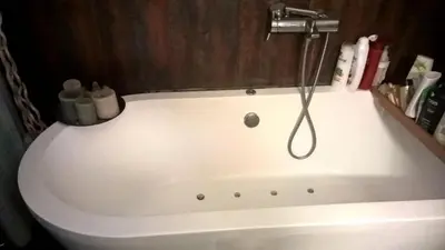 a bath tub in a bathroom with a shower at Exarchia Square central Athens 110m2 apartment in Athens