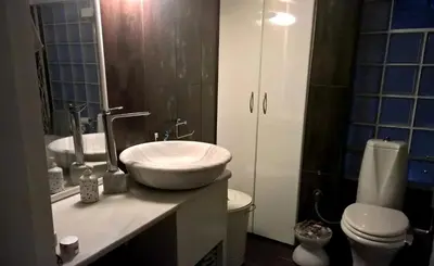 a bathroom with a sink and a toilet at Exarchia Square central Athens 110m2 apartment in Athens