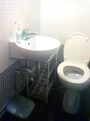 a bathroom with a white toilet and a sink at Exarchia Square central Athens 110m2 apartment in Athens