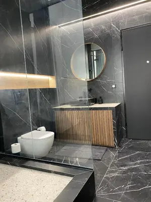 a bathroom with a toilet and a sink and a mirror at Athens Center Boutique Suites in Athens