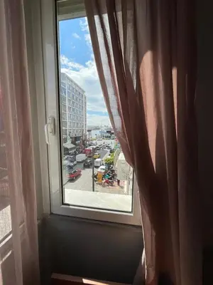 a window with a view of a city street at Piraeus Acropole Hotel in Piraeus