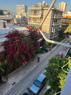 a car parked on a street in a city at Spacious and sunny appartment in Cholargos in Athens