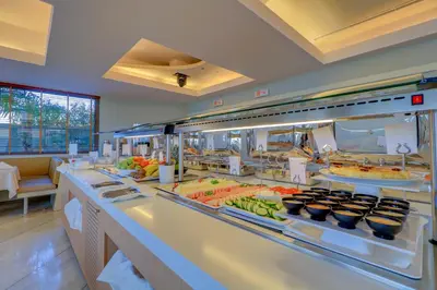 a buffet line with many different types of food at Palace Hotel Glyfada in Athens