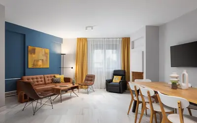 a living room with a couch and a table at Varkiza Escape Residence in Vari
