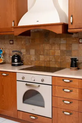 a kitchen with a stove top oven in a kitchen at Vintage Place Near ATH Airport in Markopoulo