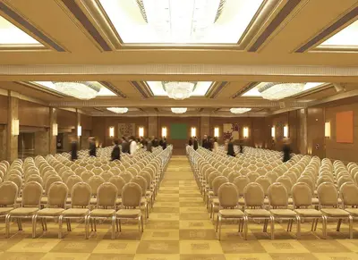 a large room with rows of chairs in a building at Athenaeum Intercontinental by IHG in Athens