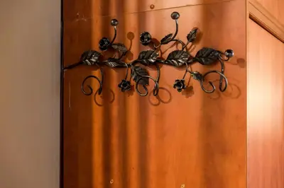 a bunch of scissors hanging on a wall at The heart of Plaka in Athens