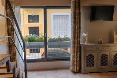 a room with a sliding glass door to a balcony at The heart of Plaka in Athens