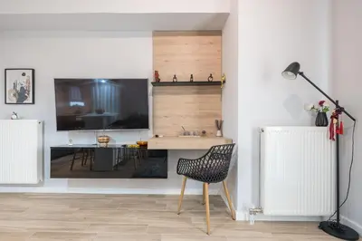 a living room with a desk and a chair at Comfy and modern apartment in Athens