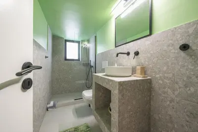a bathroom with a sink and a toilet at Comfy and modern apartment in Athens