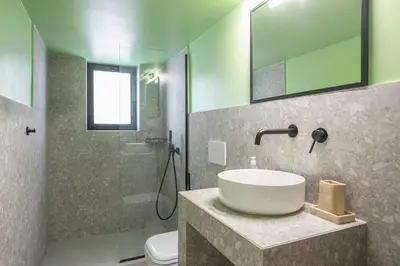 a bathroom with a sink and a shower at Comfy and modern apartment in Athens