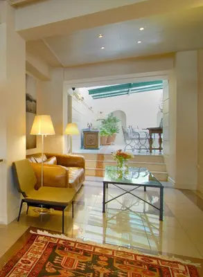 a living room with a couch and a table at Philippos Hotel in Athens