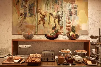 a table with food on top of a counter at Herodion Hotel in Athens