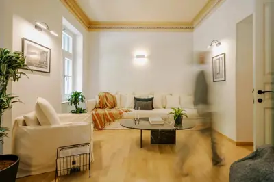 a living room with a couch and a table at Herodion Hotel in Athens