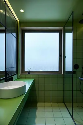 a bathroom with a tub and a large window at DWELL - Elegant City Stay in Athens
