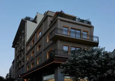a tall building with balconies on the side of it at DWELL - Elegant City Stay in Athens
