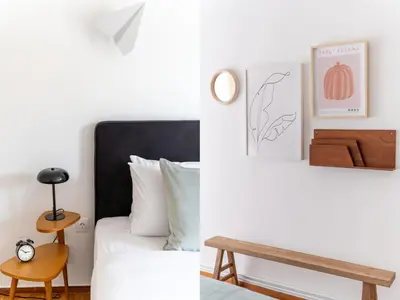 a guest bedroom with a bed and a table at Outstanding 2BR Apartment in Cholargos by UPSTREET in Athens