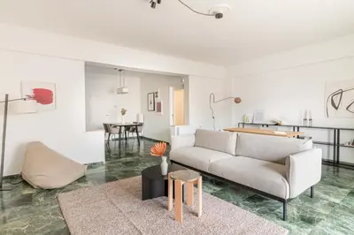 a living room with a couch and a table at Outstanding 2BR Apartment in Cholargos by UPSTREET in Athens
