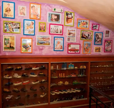 a wall filled with lots of shoes and pictures at Pergamos Hotel in Athens