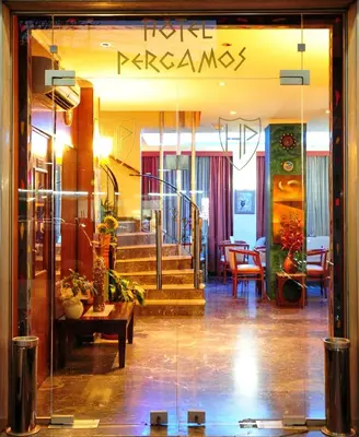 a lobby of a building with a glass door at Pergamos Hotel in Athens