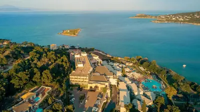 an aerial view of a resort next to the water at Zeus Dolce by Wyndham Athens in Vravrona