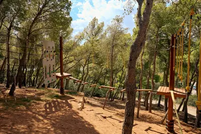 a playground in a park with a tree at Zeus Dolce by Wyndham Athens in Vravrona