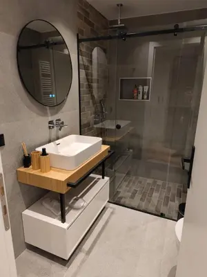 a bathroom with a sink and a shower with a mirror at A&N Athens Luxury Apartments - Ermou in Athens