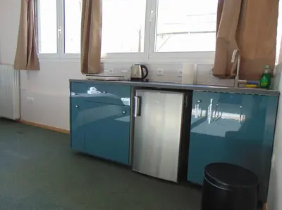 a kitchen with a blue counter and a window at Metropolis A3 -Άνετη σουίτα in Athens