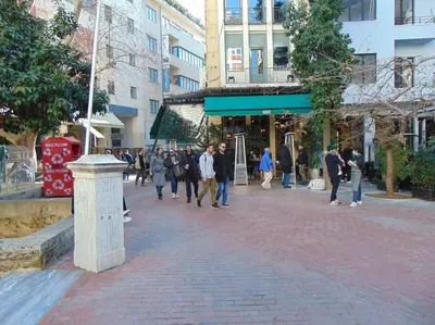 a group of people walking down a street at Metropolis A3 -Άνετη σουίτα in Athens