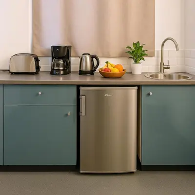 a kitchen with a counter with a sink and a refrigerator at Metropolis A3 -Άνετη σουίτα in Athens