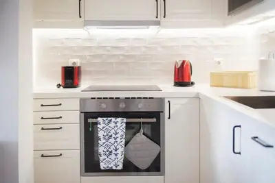 a kitchen with a stove with a towel on the oven at Pericles Penthouse *Parthenon View* Center in Athens