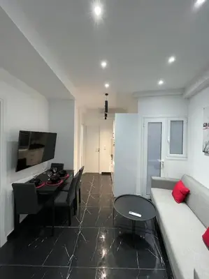 a living room with a couch and a table at ATH-Brand new 2bedroom apartment in Athens