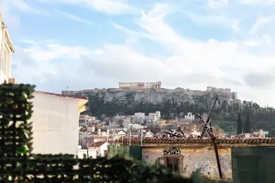 a view of a city with a hill in the background at The Parthenon View in the Historical Center! in Athens