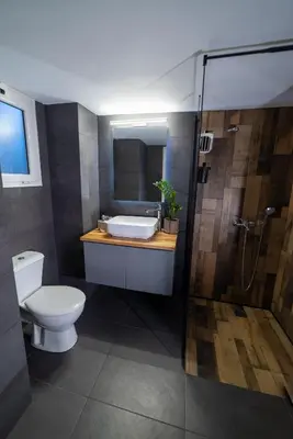 a bathroom with a toilet and a sink and a shower at Apartment_41 in Athens