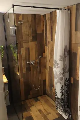 a shower with a shower curtain in a bathroom at Apartment_41 in Athens