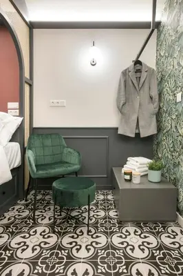 a room with a suit hanging on a wall at Athens Luxury Rooms II in Athens