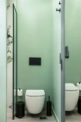a bathroom with two toilets and a mirror at Athens Luxury Rooms II in Athens