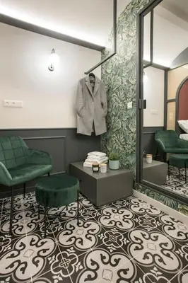 a dressing room with a suit hanging on a wall at Athens Luxury Rooms I in Athens