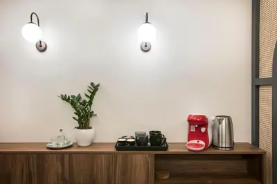 a counter with a coffee maker on top of it at Athens Luxury Rooms I in Athens