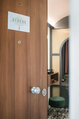 a door with a sign that reads interns on it at Athens Luxury Rooms I in Athens