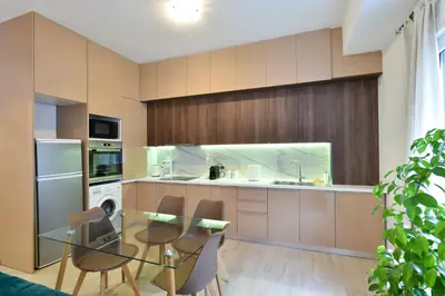 a kitchen with a glass table and chairs in a kitchen at 2bedroom Renovated Apartment in Athens