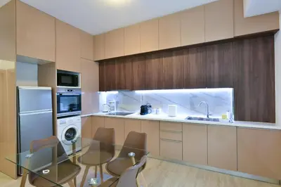 a kitchen with a glass table and a dishwasher at 2bedroom Renovated Apartment in Athens