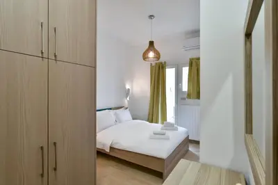 a bedroom with a white bed and a window at 2bedroom Renovated Apartment in Athens