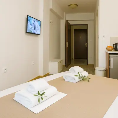 two towels on a bed in a room at Metropolis B2 -Γοητευτική Σουίτα in Athens