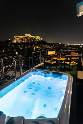 a jacuzzi tub on the roof of a building at Majestic Penthouse Acropolis in Athens