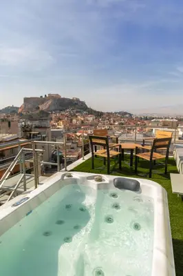 a jacuzzi tub on the roof of a house at Majestic Penthouse Acropolis in Athens