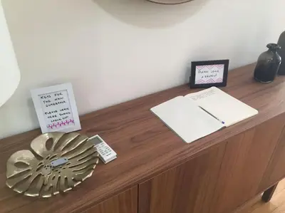 a desk with a fan and some cards on it at Athena's Nest- *best Location* A/C +HEAT! in Athens