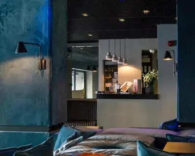a living room with a couch and a mirror at Periscope in Athens