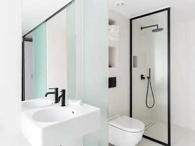 a bathroom with a sink and a toilet at Periscope in Athens